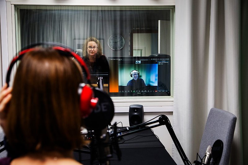 Colleagues in a recording studio.