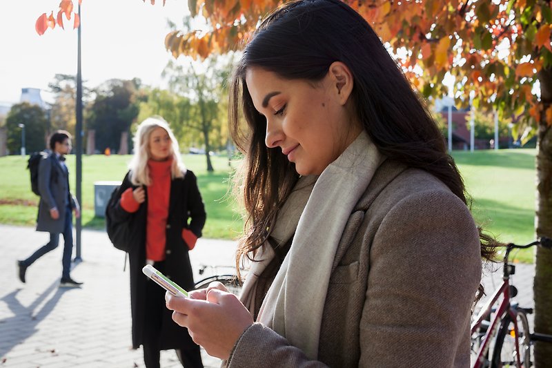 A student looking at her phone.