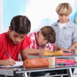 Children at school writing