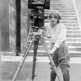 Woman holding an old camera