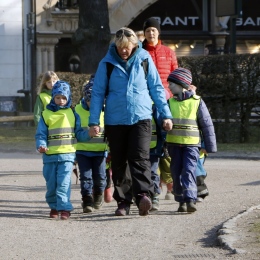 Kids in pre-school with a teacher on a walk