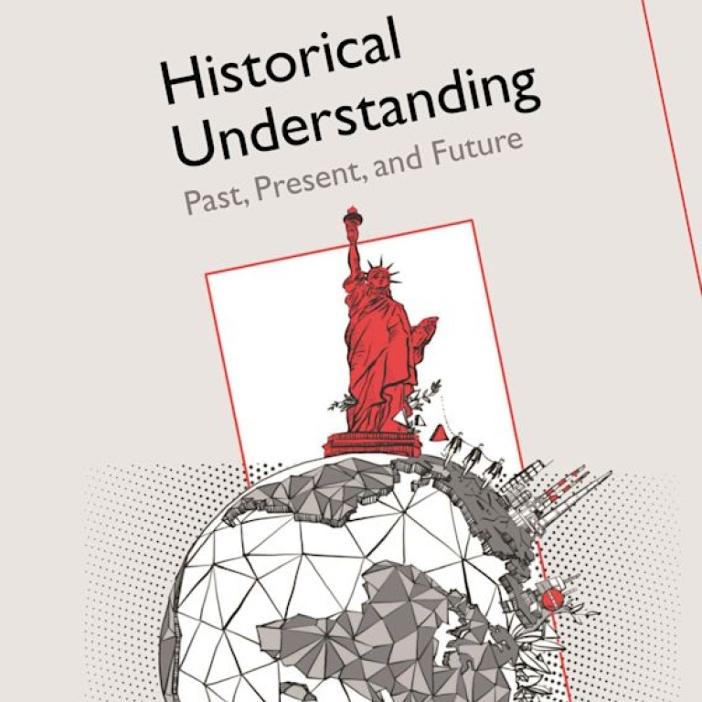 Detalj av boken Historical understandings omlsag. En teckning på jordklotet med frihetsgudinnan på