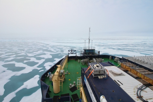 The foredeck of the icebreaker Oden with the atmospheric measurement tower, moving through sea ice w