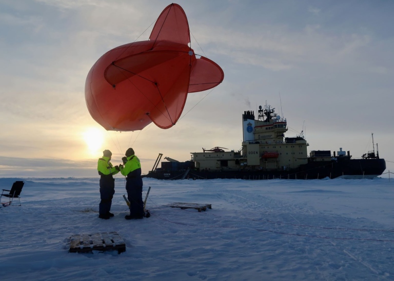 Scientists working on the ice in the North Pole during expedition Arctic Ocean 2018. Credit: Paul Zi