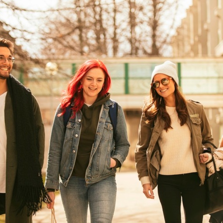 Four students walking at Campus.