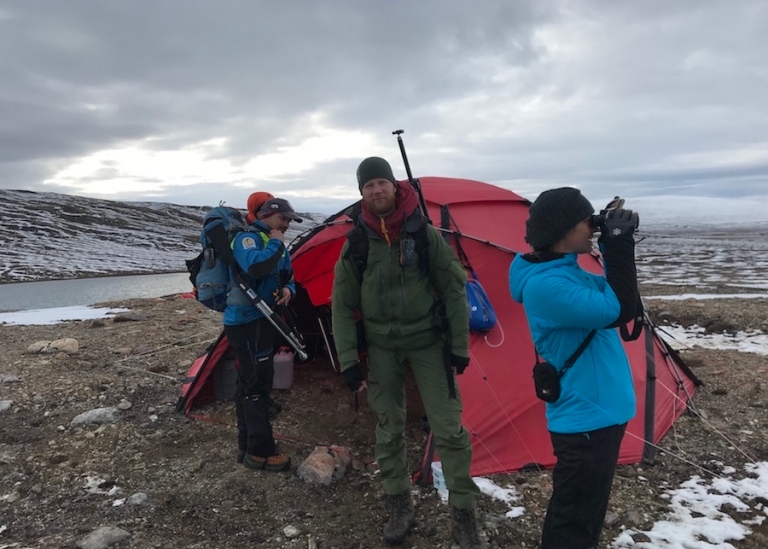 people around a tent, greenland