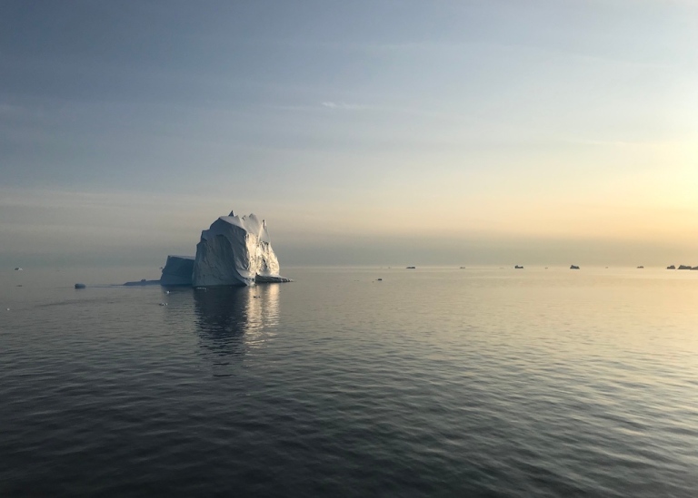 Small iceberg with evening sun light
