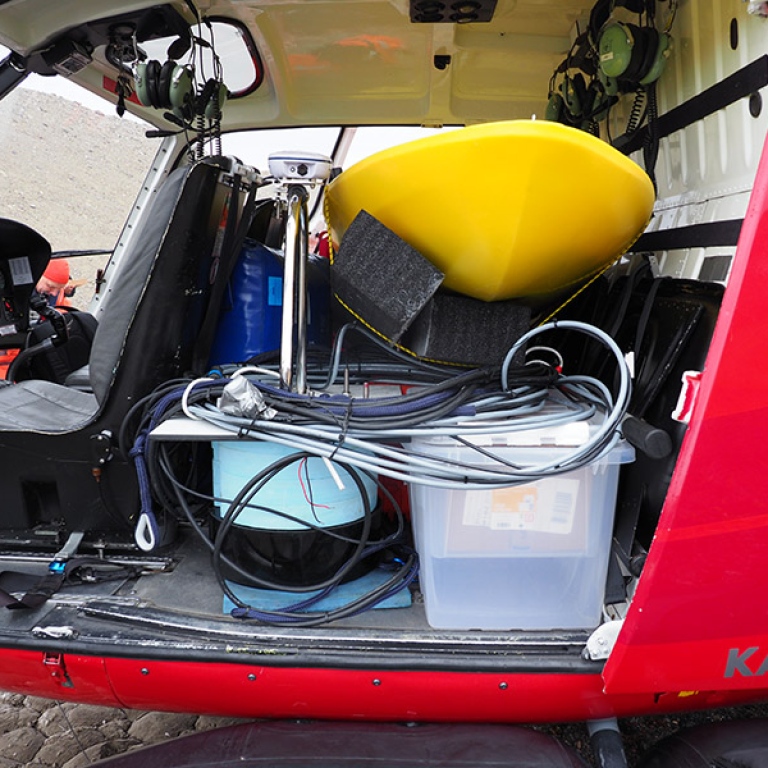 Helicopter fully packed with the EchoBoat and the towable sub-bottom profiler.