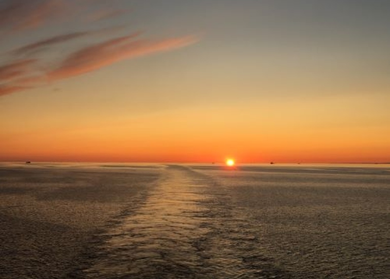 sunset on horizon, onboard icebreaker Oden
