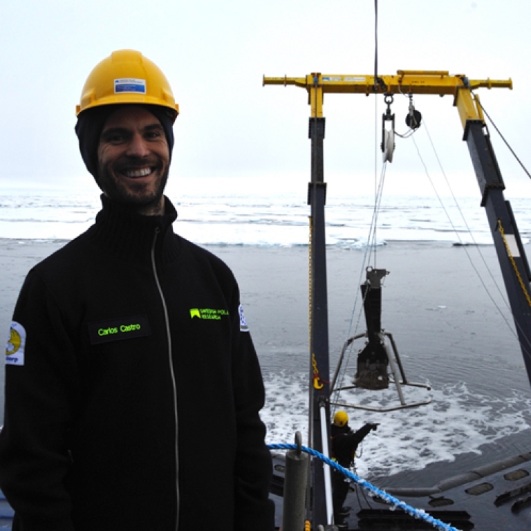Researcher on deck, Icebreaker Oden, smiling at camera