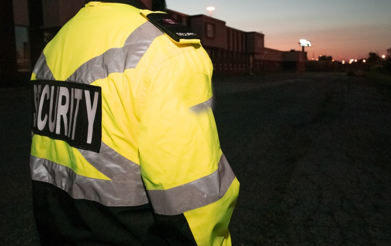 Security guard in the street in the early morning. Photo: Flex Point Security on Unsplash.