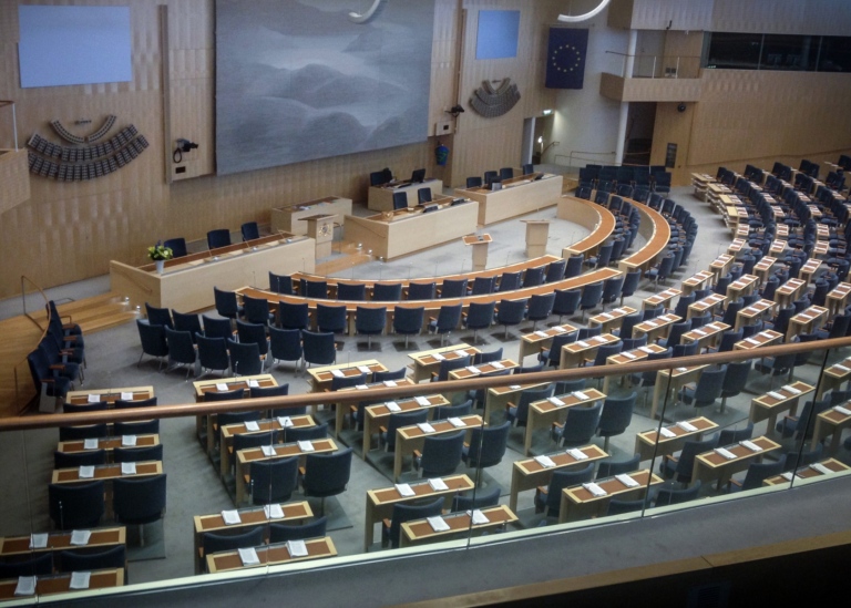 Bild på plenisalen i Sveriges riksdag.