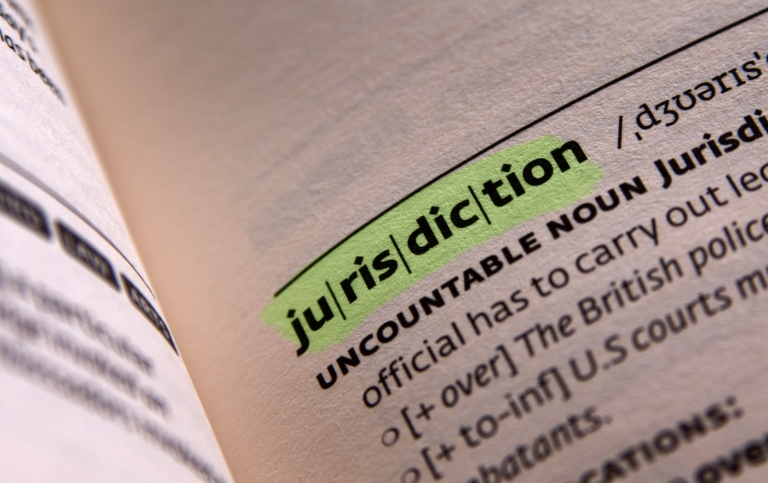 open encyclopedia with the word jurisdiction in focus