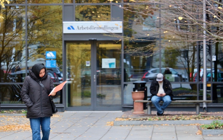 A woman walks from the office of the Swedish Employment Service 