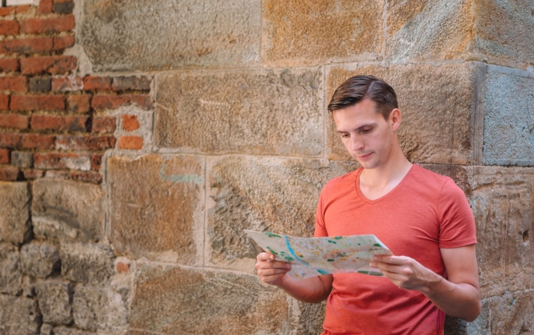 Young man looking at a map.