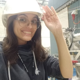Half-bust picture of Elisabetta Nocerino working at a large scale facility