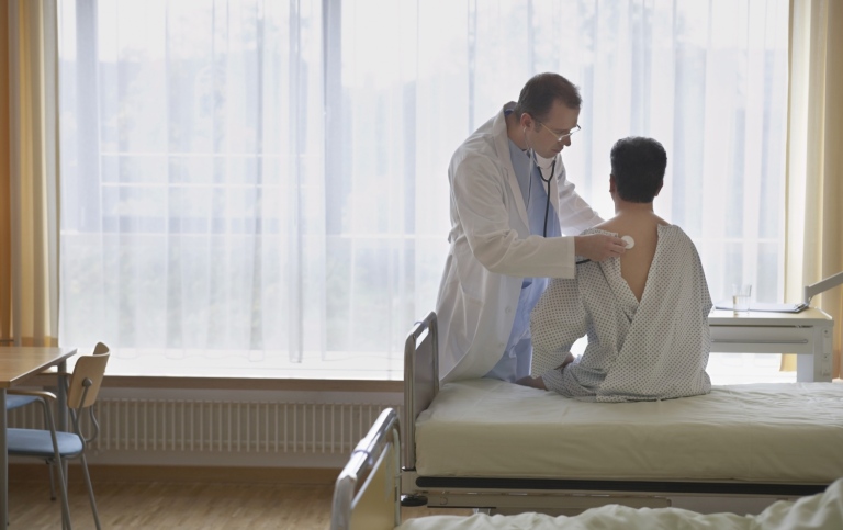 Doctor and patient in a hospital room