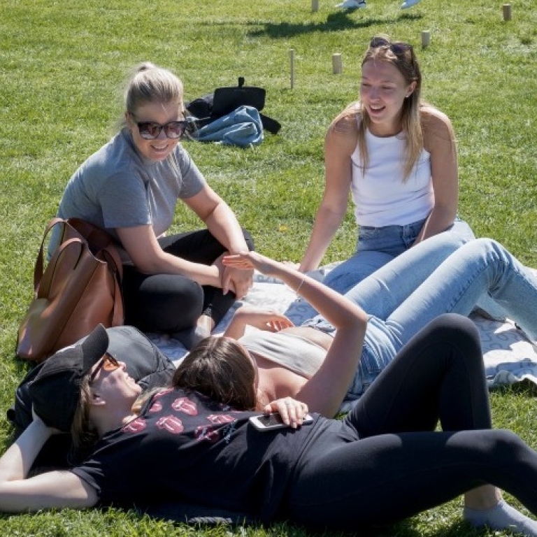 Students sitting on the grass at Campus Frescati. Photographer: Jens Olof Lasthein