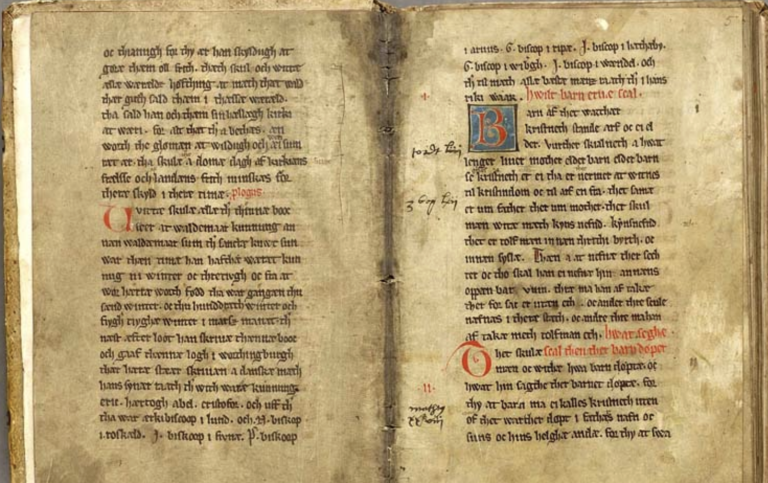 Uppslag i medeltida bok med handskriven text