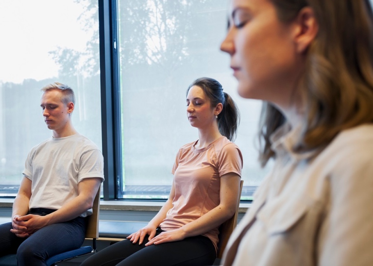 Three students participating in meditation group at Stockholm Student Health Services.