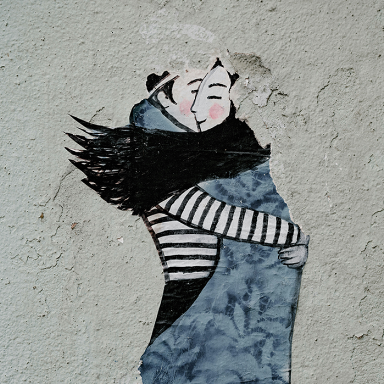 Wall painting of a man and woman hugging