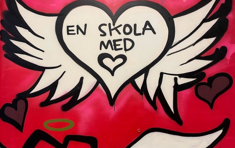 A heart w. wings and Swedish text "A school with" + drawn heart. Another heart w. wings and a halo.