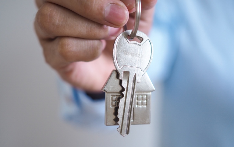 A hand holding a set of keys.