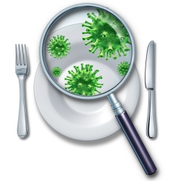 Illustration of a magnifying glass that shows bacteria on a white plate.