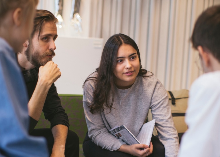 Four young people discussing