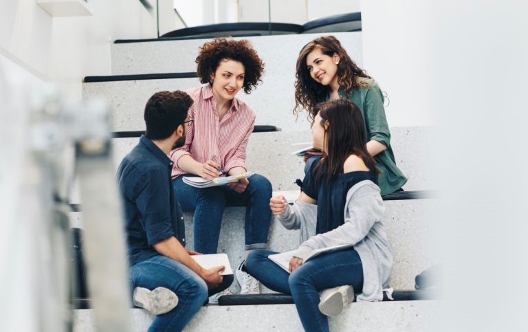 A small group of students talking to each other.